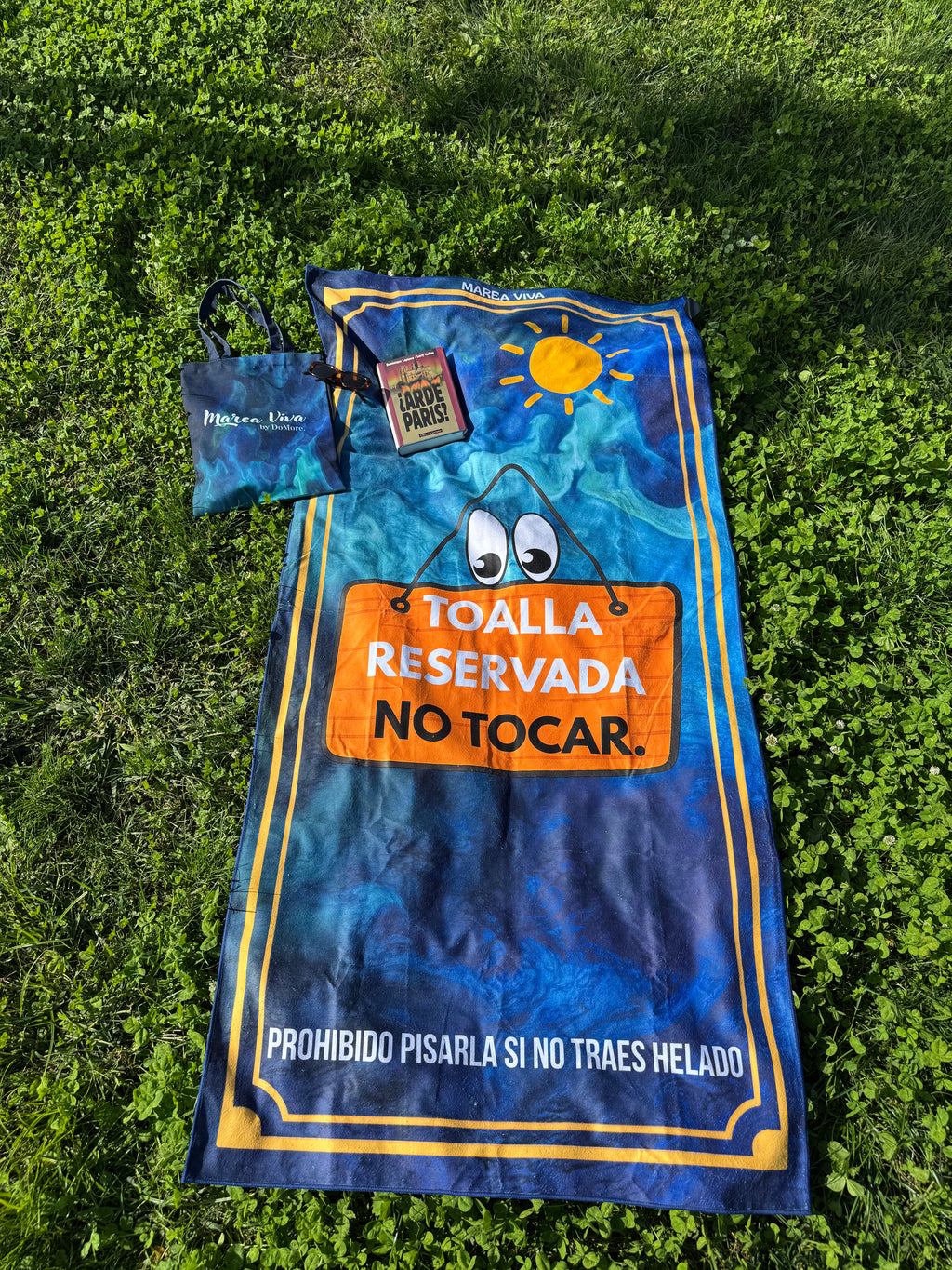 Tu toalla de playa DOMORE —  Símbolo de pausa y actitud